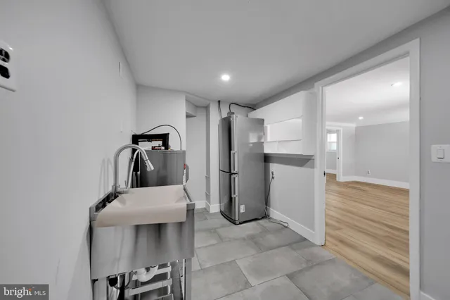 a bathroom with a sink and shower