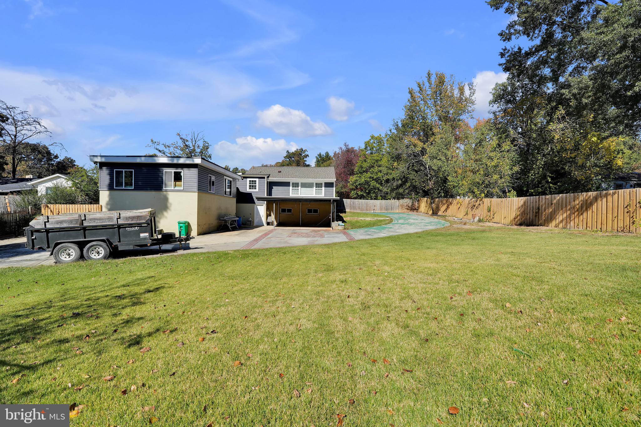 9305 4th Street Lanham, MD 20706 - Photo 39 of 45 a swimming pool with outdoor seating and yard
