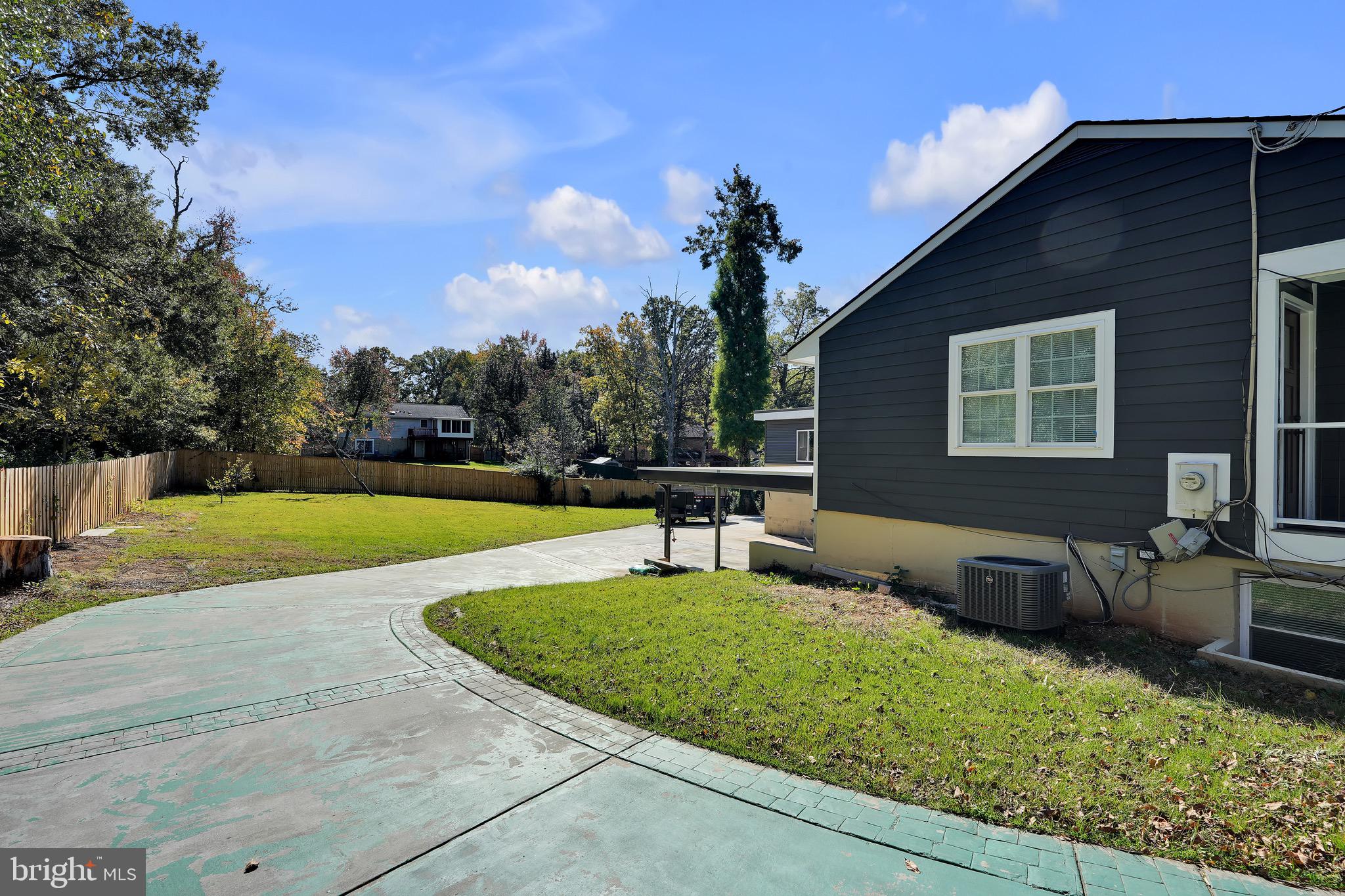 9305 4th Street Lanham, MD 20706 - Photo 41 of 45 a front view of a house with garden