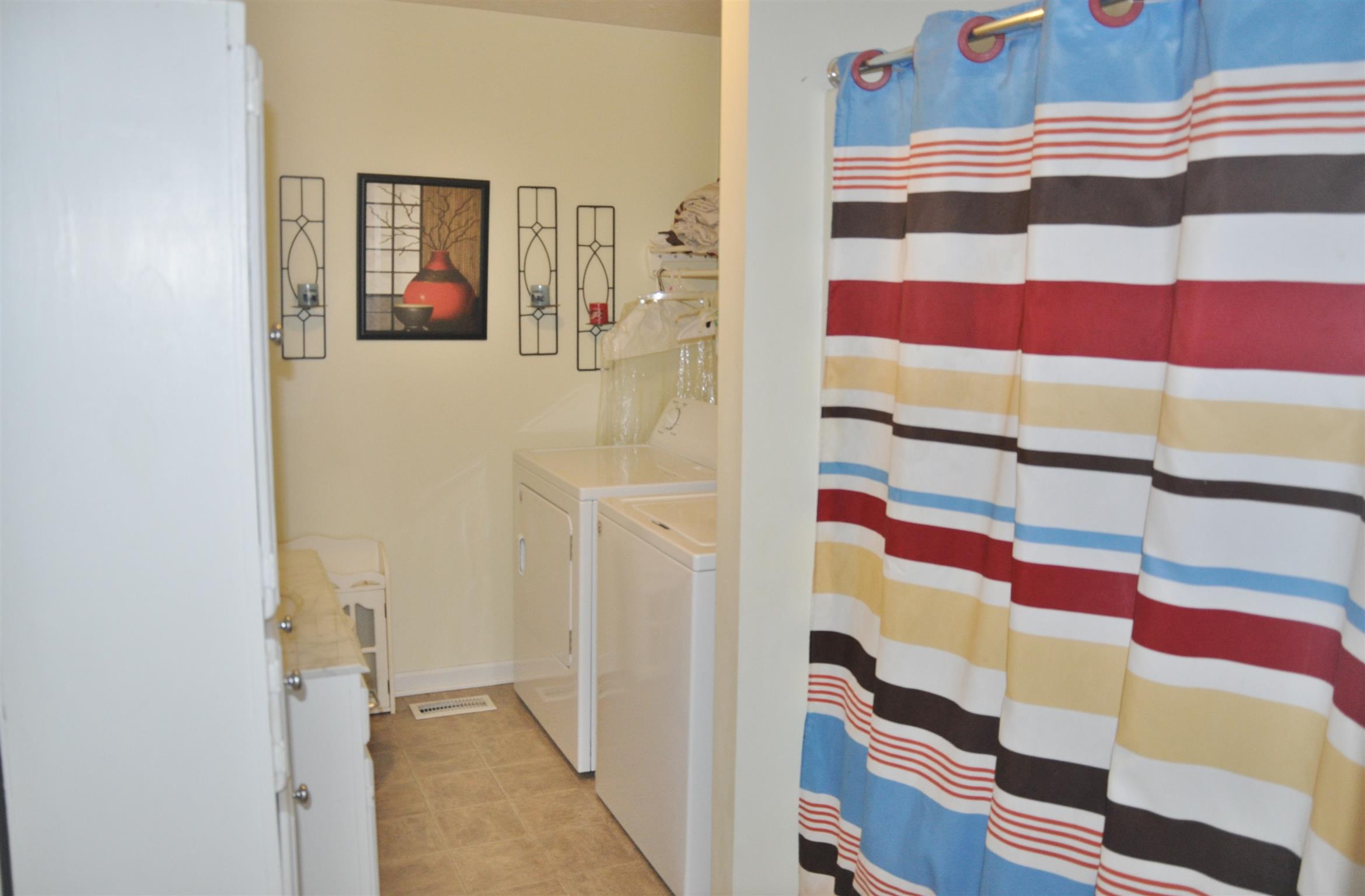 1283 Dale Ridge Road Dowelltown, TN 37059 - Photo 8 of 11 a view of a bedroom with a bed and furniture