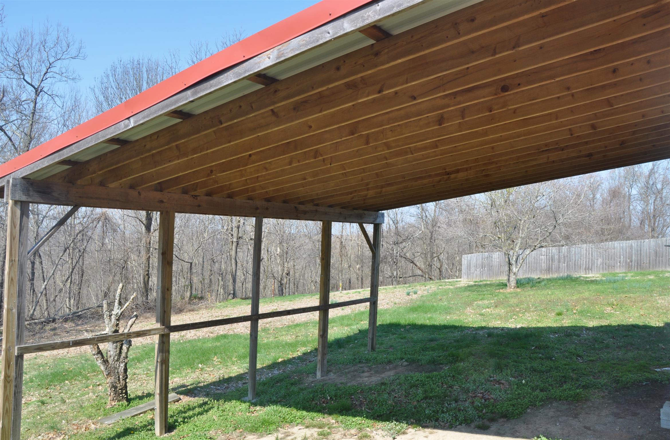 1283 Dale Ridge Road Dowelltown, TN 37059 - Photo 10 of 11 a backyard with a garden