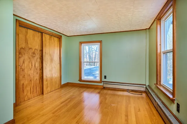 a view of an empty room with glass door