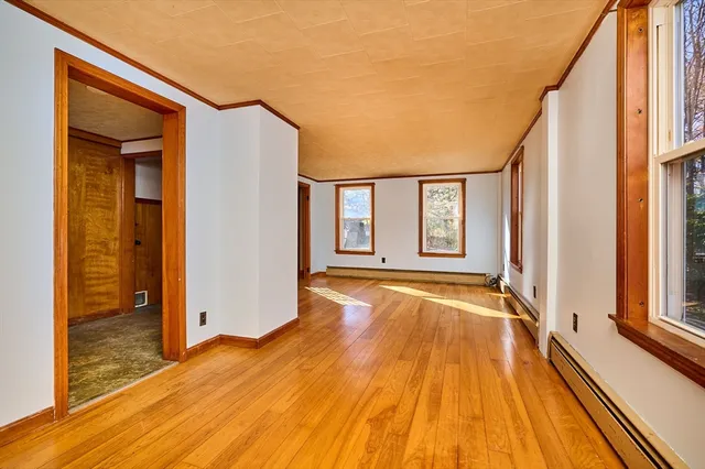 a view of a house with wooden floor and stairs
