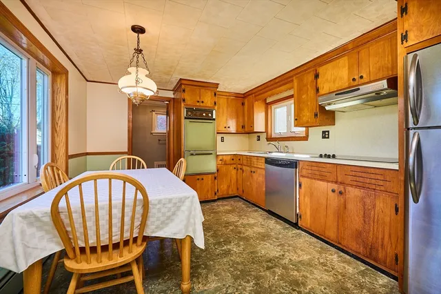 a very nice looking kitchen with a large window