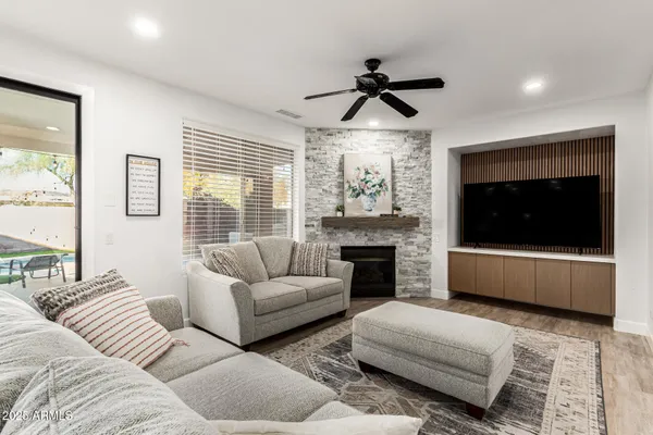 a living room with furniture and a fireplace
