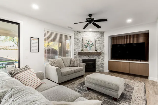a living room with furniture and a fireplace