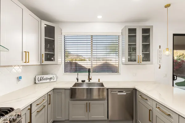 a kitchen with a sink and cabinets