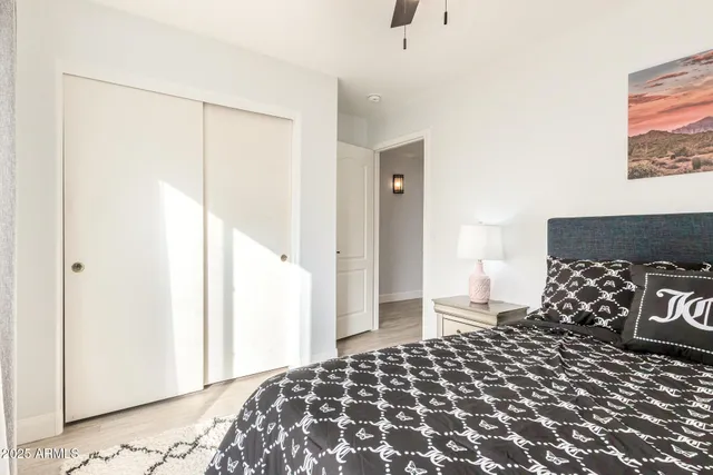 a bathroom with a sink a toilet a mirror and shower