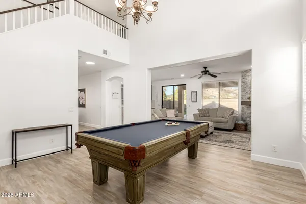 a living room with furniture a table and decor