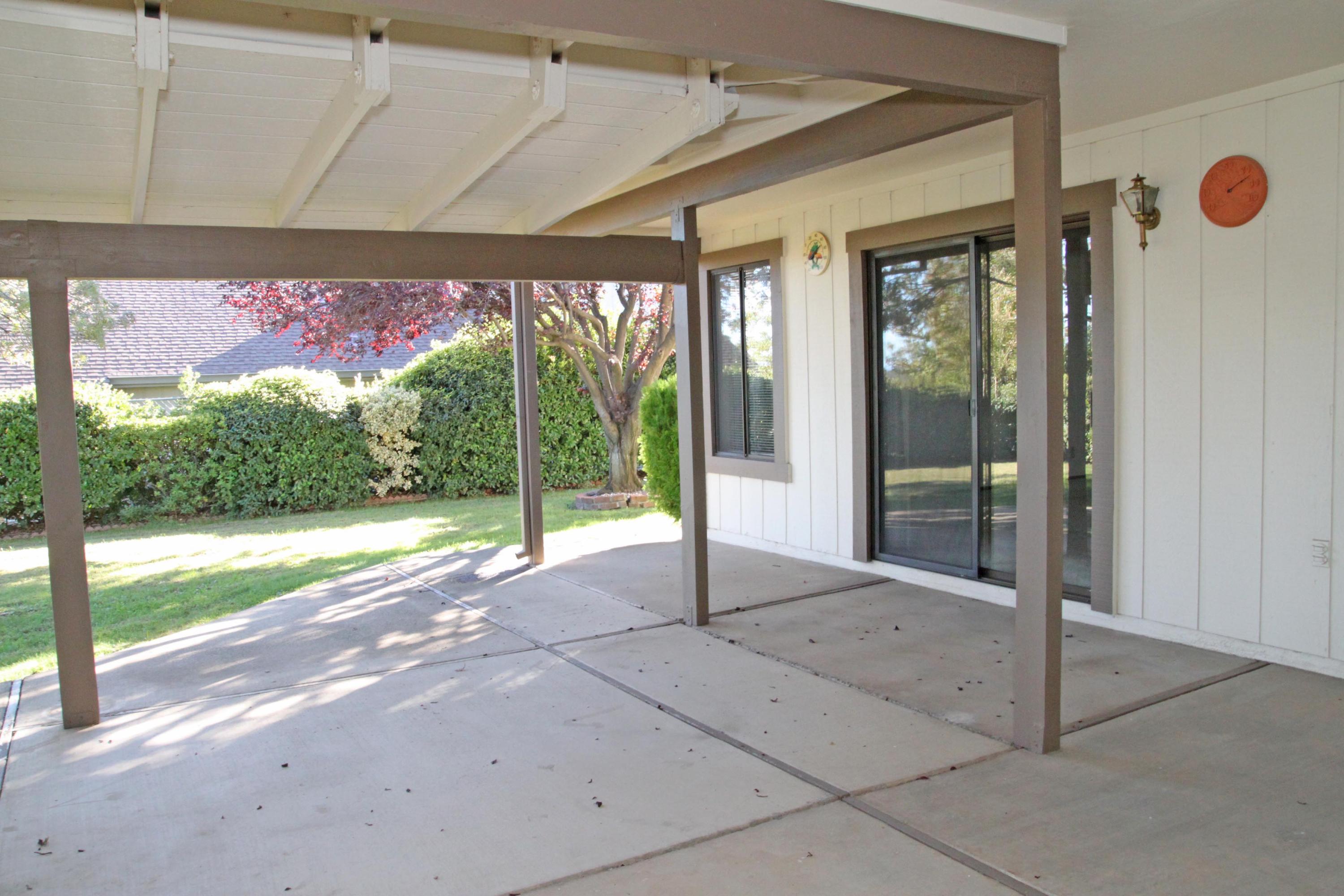 5589 Trish Court Redding, CA 96003 - Photo 17 of 20 a view of a room with porch and a patio