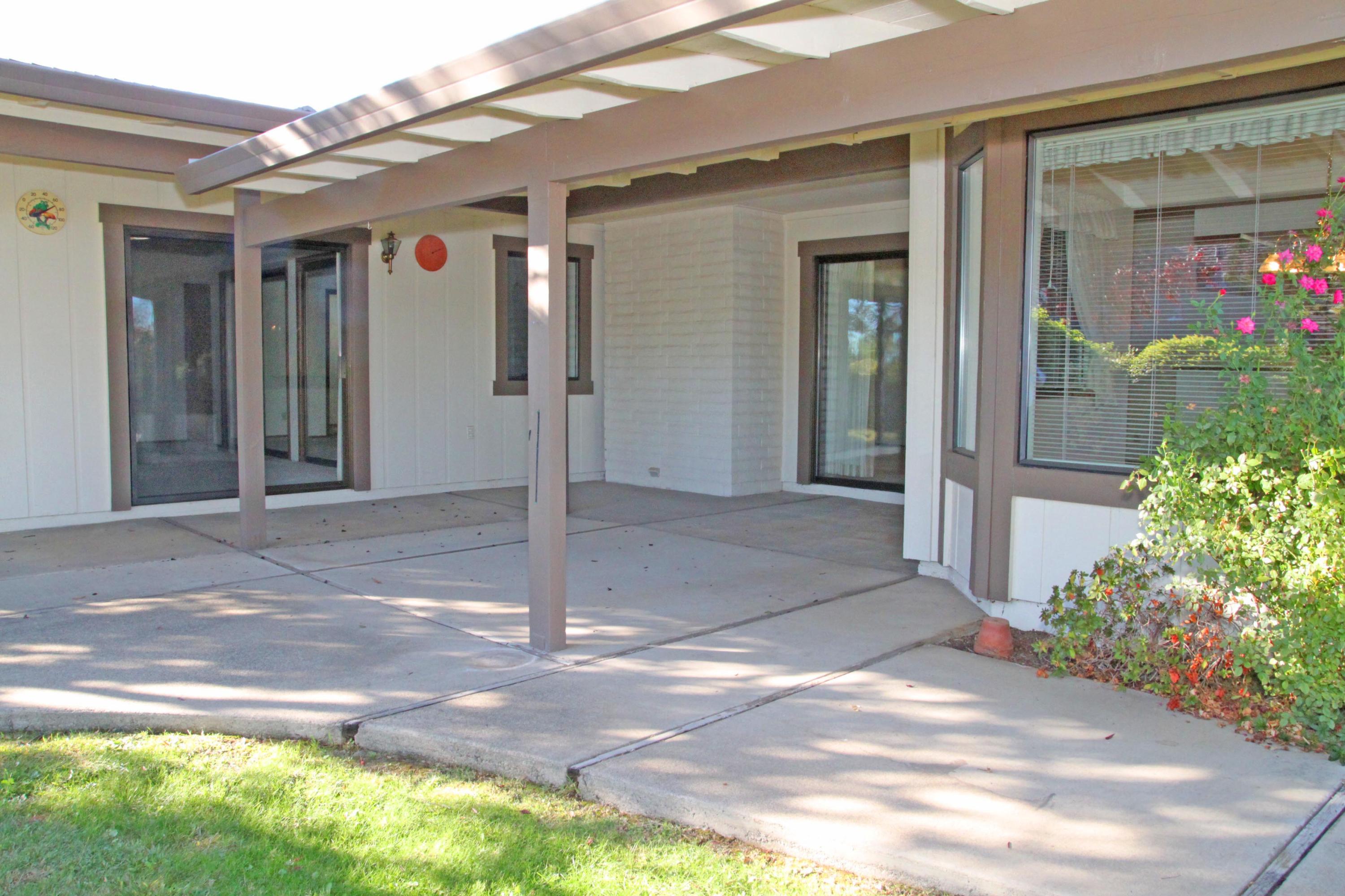 5589 Trish Court Redding, CA 96003 - Photo 18 of 20 a view of a house with backyard