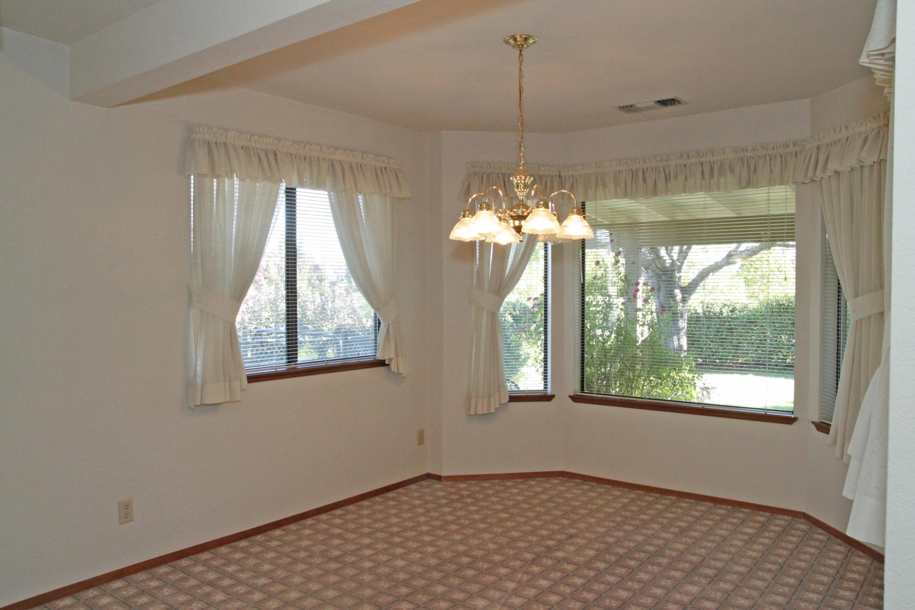 5589 Trish Court Redding, CA 96003 - Photo 9 of 20 a view of an empty room with a window