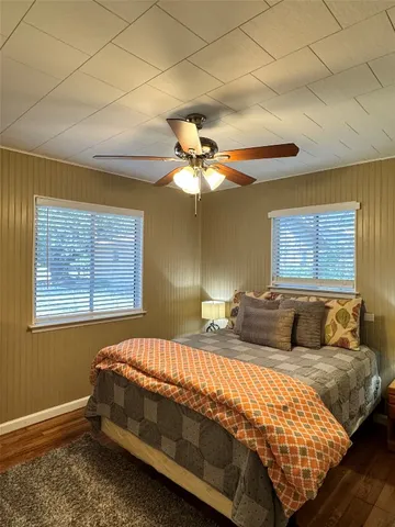 a bedroom with a bed and window