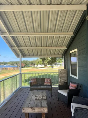 a view of a two chairs in the balcony