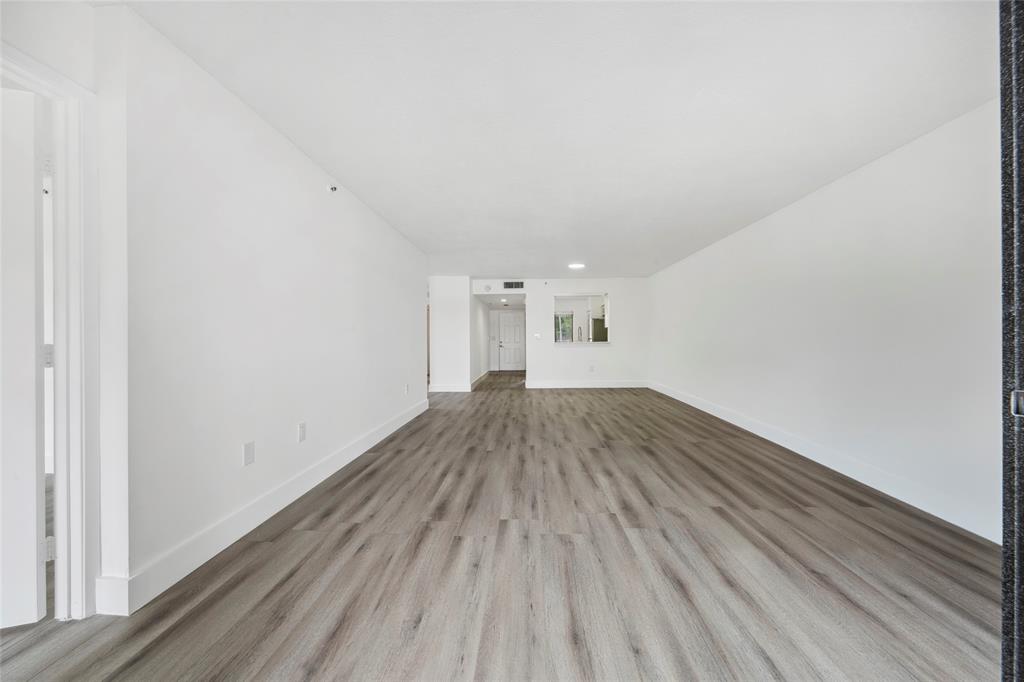 6269 Pointe Regal Circle, Unit 210 Delray Beach, FL 33484 - Photo 16 of 29 a view of a room with wooden floor