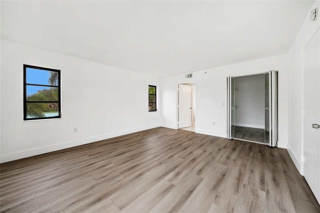 6269 Pointe Regal Circle, Unit 210 Delray Beach, FL 33484 - Photo 21 of 29 a view of an empty room and window