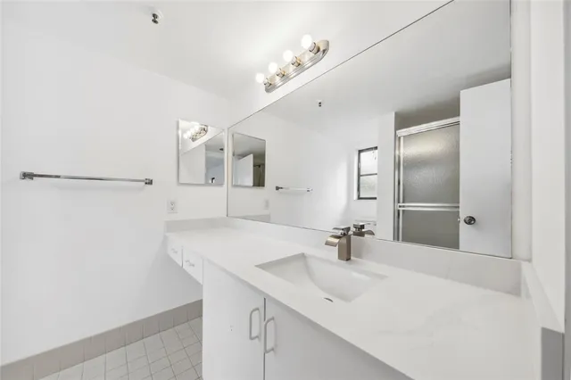 a bathroom with a sink and a mirror