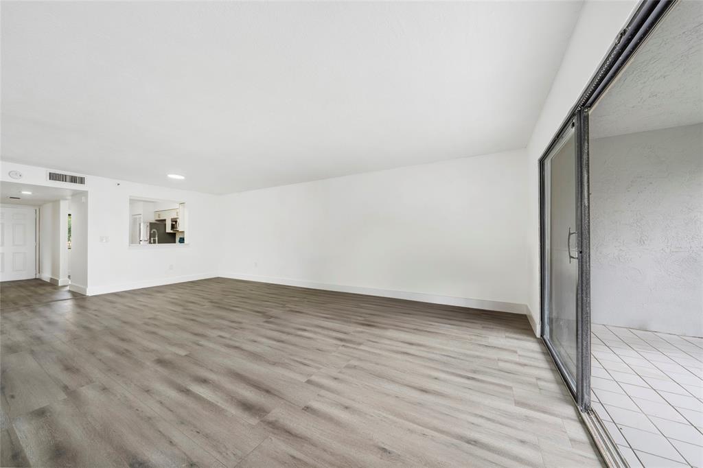 6269 Pointe Regal Circle, Unit 210 Delray Beach, FL 33484 - Photo 24 of 29 a view of empty room with wooden floor