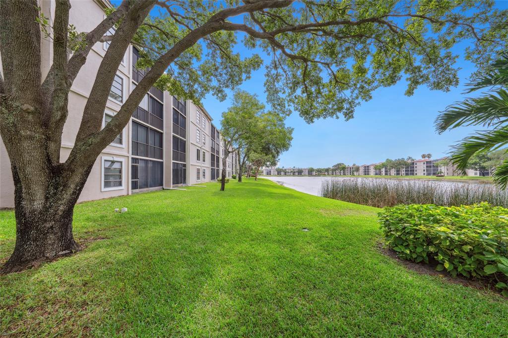 6269 Pointe Regal Circle, Unit 210 Delray Beach, FL 33484 - Photo 27 of 29 a view of a house with a yard