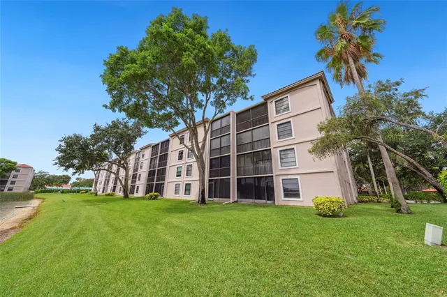 a view of a building with a yard