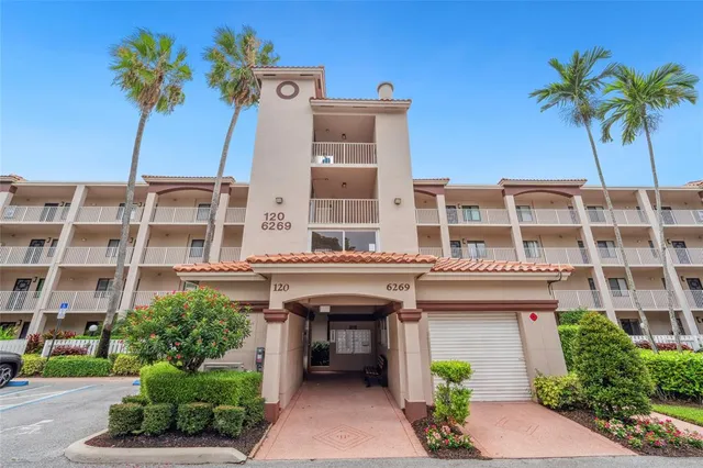 a front view of a building with potted plants