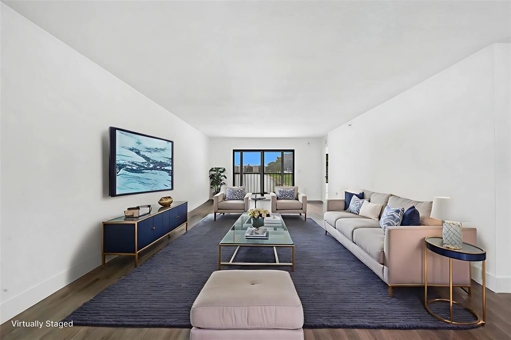 6269 Pointe Regal Circle, Unit 210 Delray Beach, FL 33484 - Photo 5 of 29 a living room with furniture rug and window