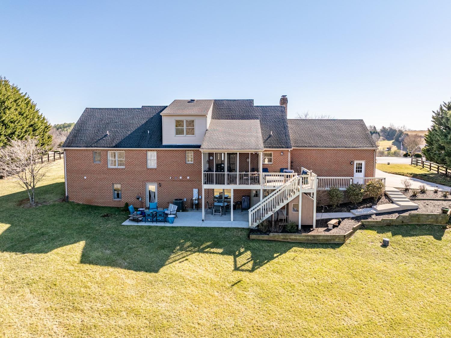 325 Longhill Road Goode, VA 24556 - Photo 5 of 71 a front view of house with outdoor space and swimming pool