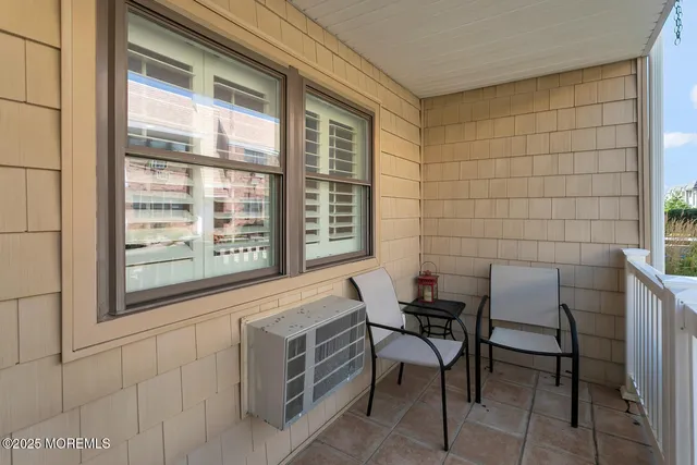 a view of a chair and table in a room