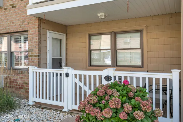 a view of a porch with a garden