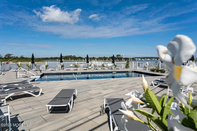 a terrace with outdoor seating and city view