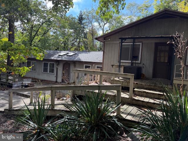 8629 Indian Springs Road Frederick, MD 21702 - Photo 2 of 9 a view of a house with backyard sitting area and garden