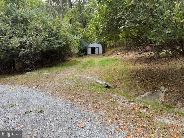 8629 Indian Springs Road Frederick, MD 21702 - Photo 8 of 9 a view of a tiny house with a yard