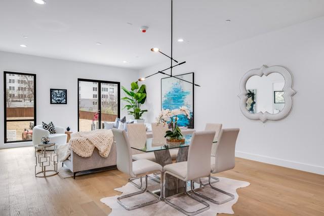 3601 Routh Street, Unit 2E Dallas, TX 75219 - Photo 3 of 14 Dining space with light wood finished floors, baseboards, and recessed lighting