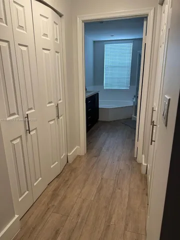 a bathroom with a sink toilet and mirror