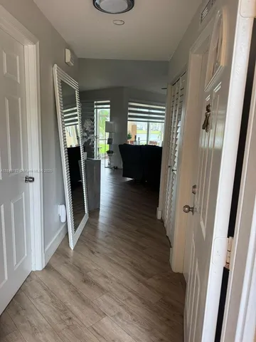 a bathroom with a double vanity sink and mirror