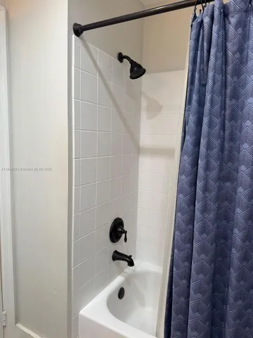 a view of entryway with washer and dryer