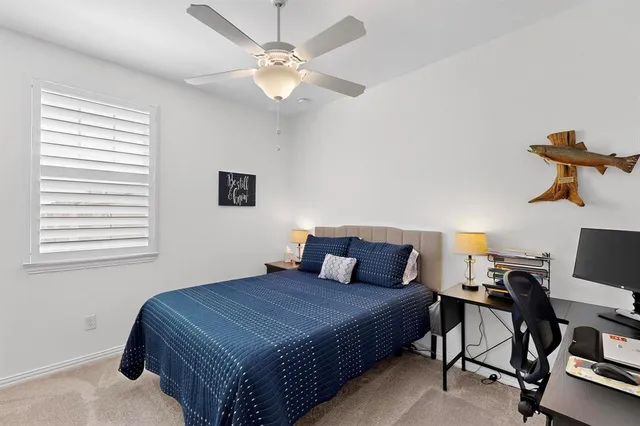 a livingroom with workspace and a couch