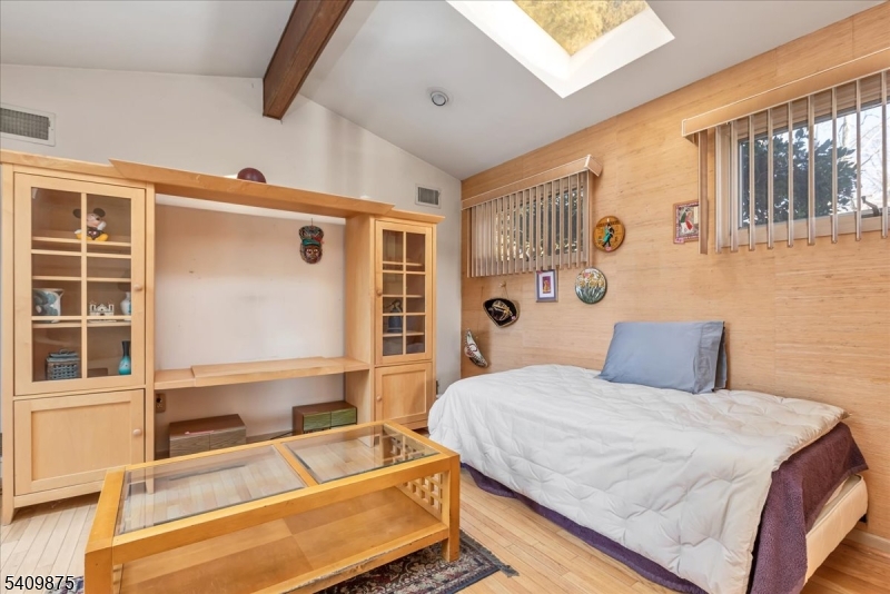 29 Manitou Circle Westfield, NJ 07090 - Photo 12 of 35 a bedroom with a bed and a flat tv screen on dresser