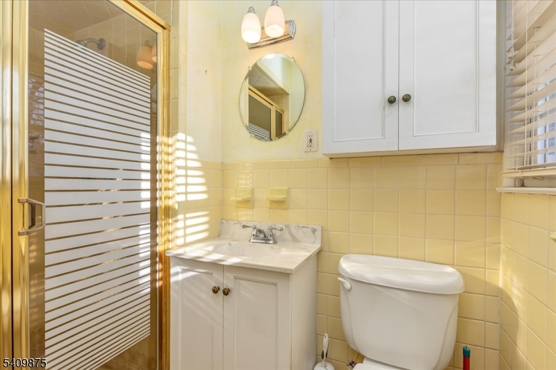 29 Manitou Circle Westfield, NJ 07090 - Photo 24 of 35 a bathroom with a toilet a sink and mirror