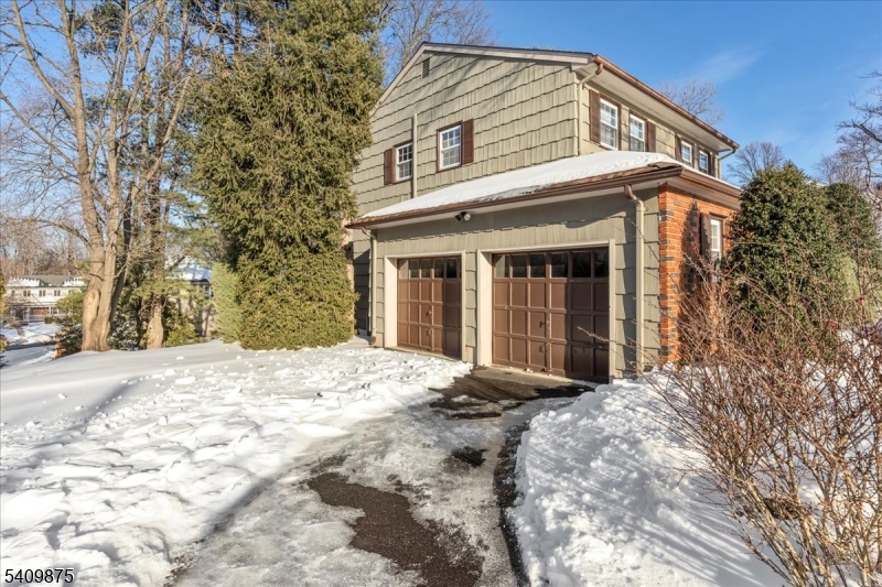29 Manitou Circle Westfield, NJ 07090 - Photo 34 of 35 a view of a white house with a large tree