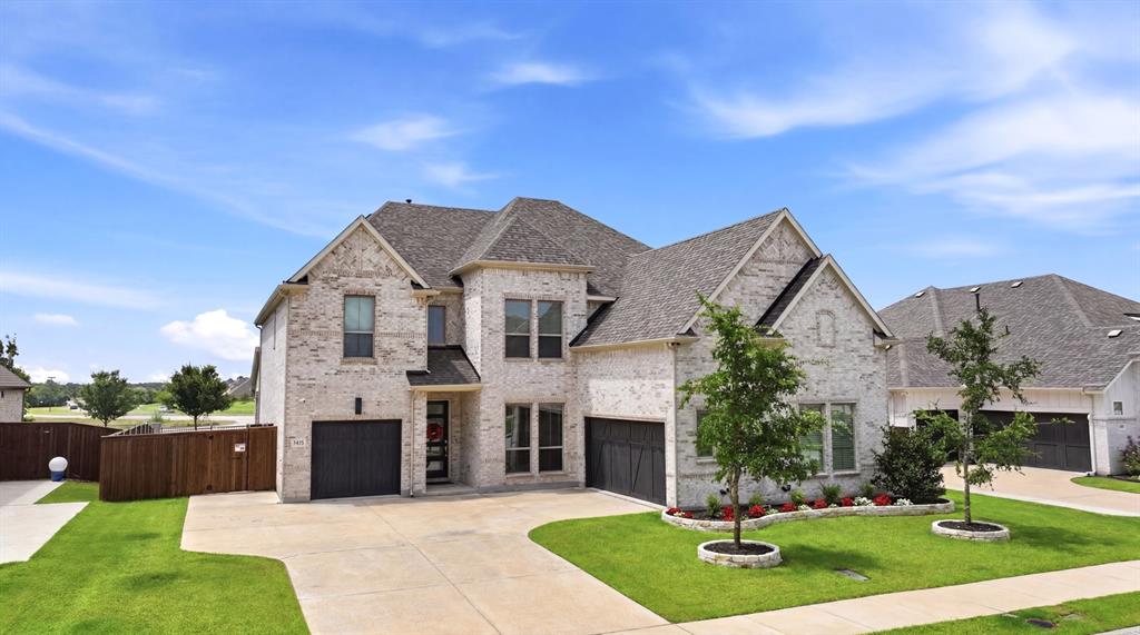 1313 Kirkwood Road Rockwall, TX 75087 - Photo 10 of 39 3-car garage with extra parking space in driveway.