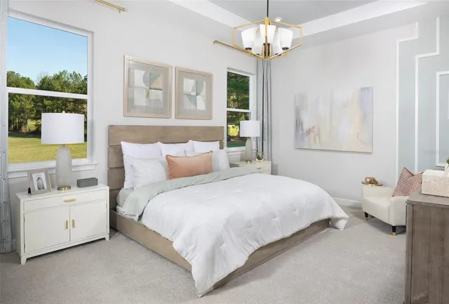 a bedroom with bed and window