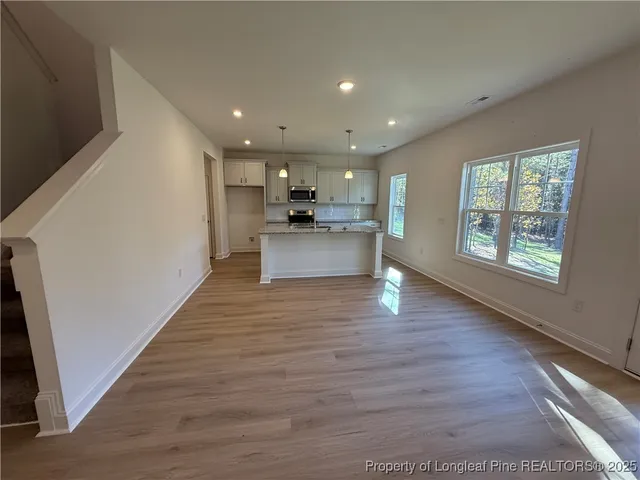 a view of a kitchen and an entryway
