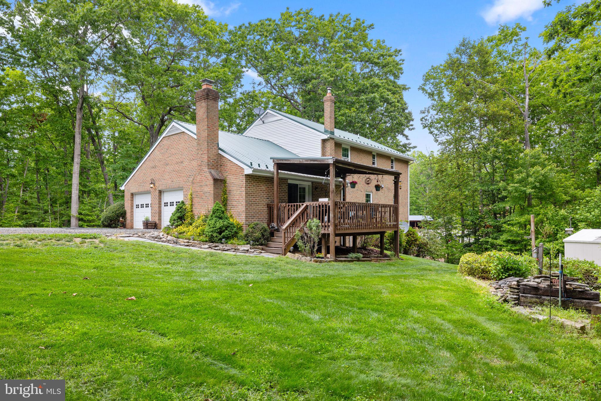 5099 Courtneys Corner Road Sumerduck, VA 22742 - Photo 6 of 52 a view of a house with backyard and sitting area