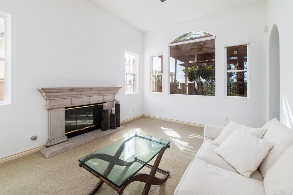 6237 Paseo Privado Carlsbad, CA 92009 - Photo 17 of 29 a living room with furniture and a fireplace