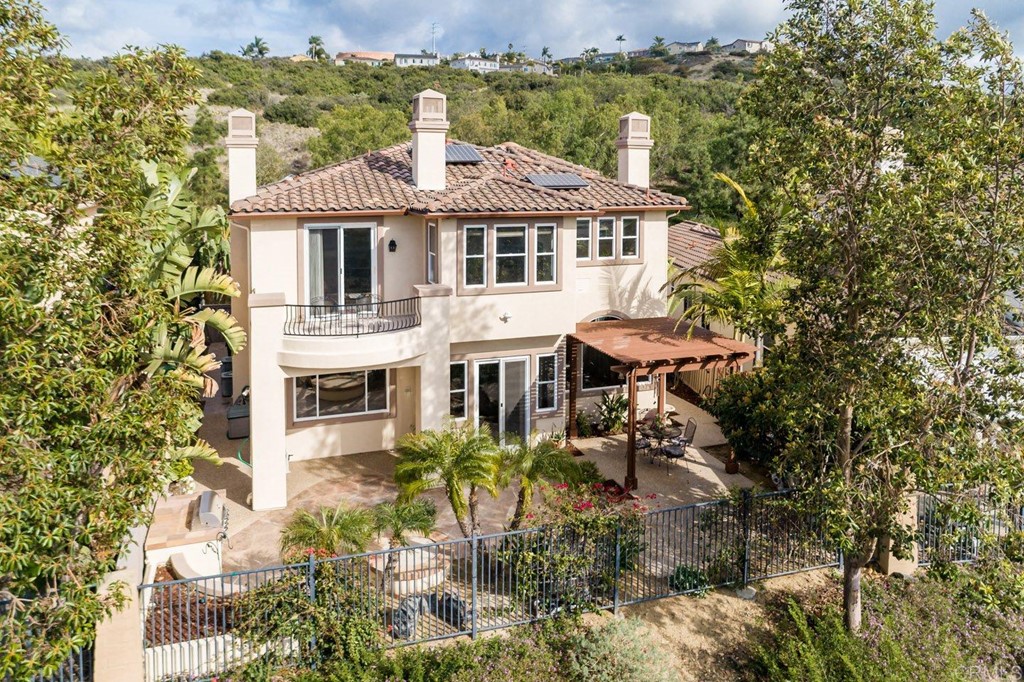 6237 Paseo Privado Carlsbad, CA 92009 - Photo 20 of 29 a aerial view of a house with a yard table and chairs