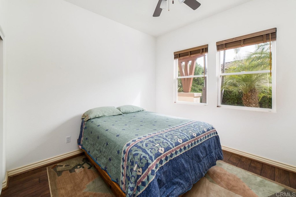 6237 Paseo Privado Carlsbad, CA 92009 - Photo 25 of 29 a bedroom with a bed and a window