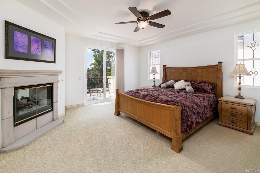 6237 Paseo Privado Carlsbad, CA 92009 - Photo 7 of 29 a bed room with a bed and a fireplace