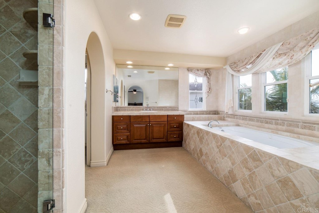6237 Paseo Privado Carlsbad, CA 92009 - Photo 9 of 29 a large bathroom with a large tub and sink