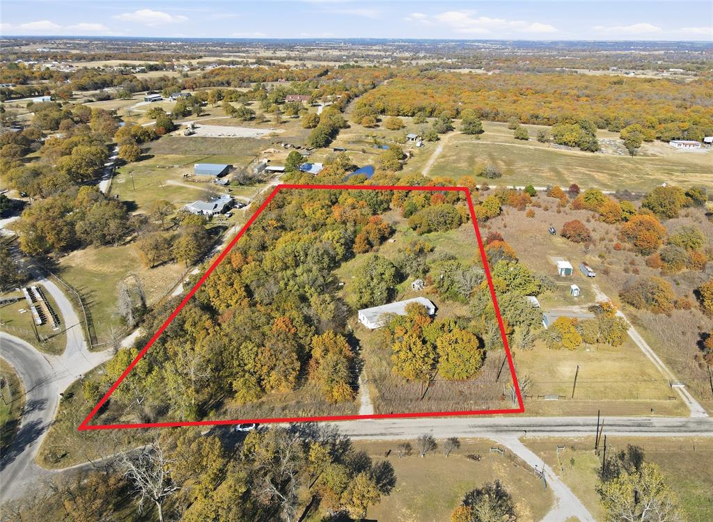 113 County Road 4860 Azle, TX 76020 - Photo 3 of 6 an aerial view of residential houses with outdoor space